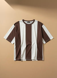 A short-sleeve crewneck t-shirt with vertical brown and white stripes, displayed flat against a warm beige background.