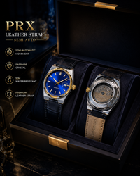 Two luxury semi-automatic wristwatches with leather straps displayed inside an open black presentation box. The watch on the left has a blue dial and silver-toned case with gold accents, while the watch on the right has a skeleton dial and a tan leather strap.