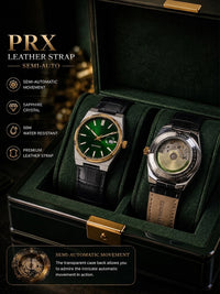 Two PRX leather strap semi-auto mechanical watches displayed inside an open dark green presentation box with gold-tone hardware. The left watch has a green dial and black leather strap, while the right watch shows a transparent case back with a beige leather strap.